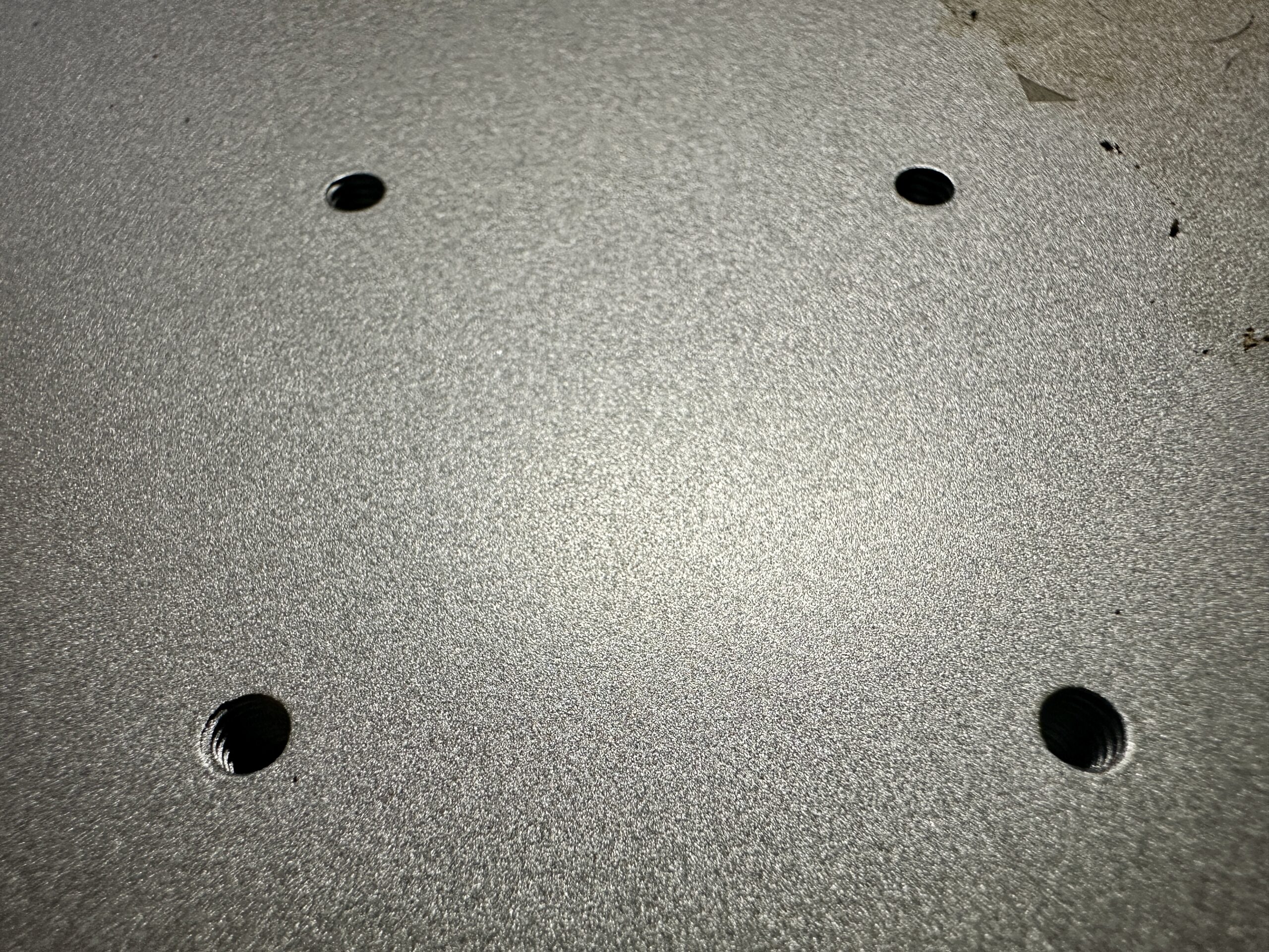 Close up look at the base of the xTool F1 Ultra with screw holes - cuttingforbusiness.com