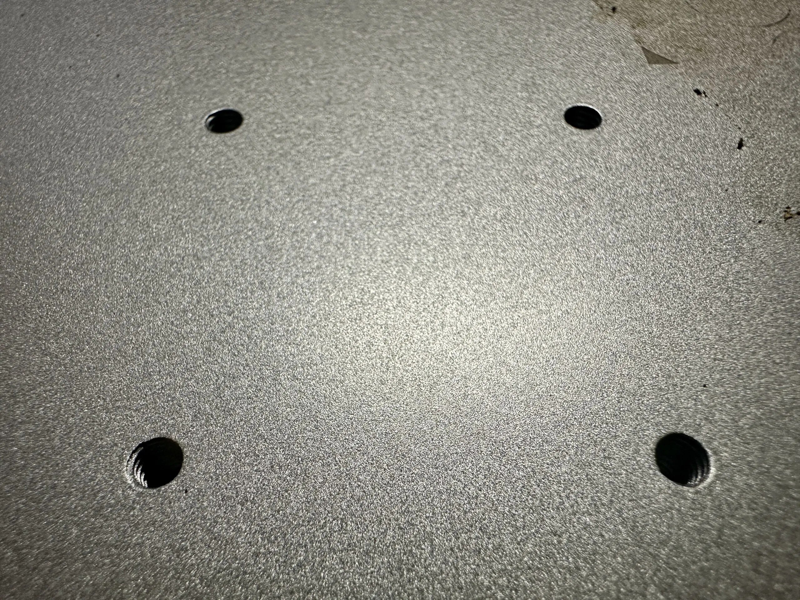 Close up look at the base of the xTool F1 Ultra with screw holes - cuttingforbusiness.com