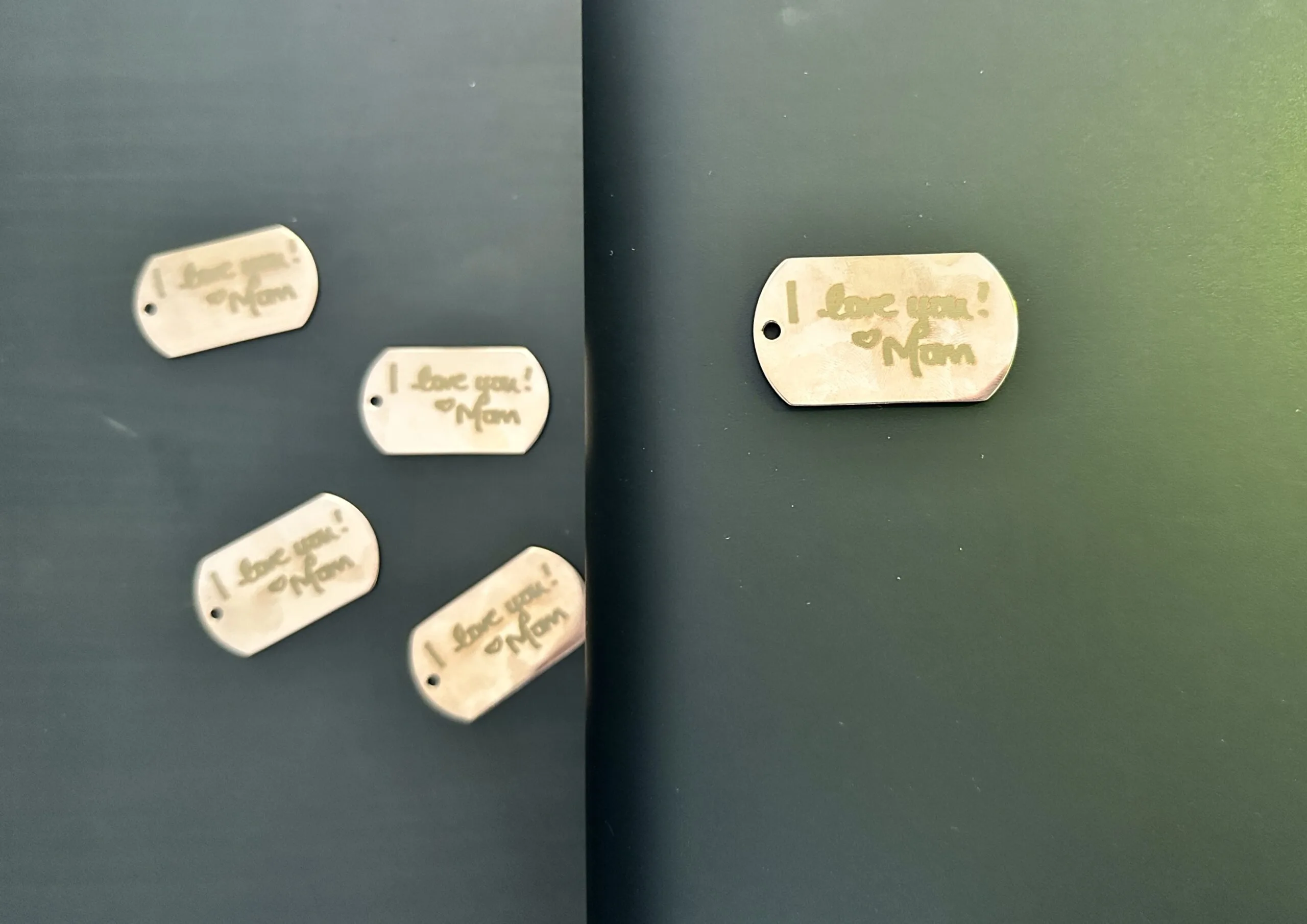 Processed engraved dog tags using the xTool F1 Ultra conveyor belt - cuttingforbusiness.com